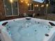 Close up of a hot tub filled with clear water, accented by blue lights, creating a luxurious and relaxing experience at 104 Jackson Rd, Ladson, SC 29456