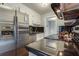 Modern kitchen with stainless steel appliances, black countertops, and bright white cabinetry, offering a clean and stylish design at 104 Jackson Rd, Ladson, SC 29456