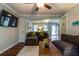 Cozy living room boasts hardwood floors, comfortable sectional seating, and an open layout, perfect for entertaining at 104 Jackson Rd, Ladson, SC 29456
