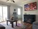 Comfortable living room featuring a modern fireplace, TV, ceiling fan, and wood coffee table at 104 Jackson Rd, Ladson, SC 29456
