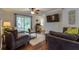 Cozy living area featuring sliding glass doors, TV, ceiling fan, and comfortable seating at 104 Jackson Rd, Ladson, SC 29456