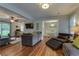 Bright living space with hardwood flooring, comfortable gray sofas, and adjacent dining area at 104 Jackson Rd, Ladson, SC 29456
