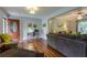 Inviting living room with hardwood floors, comfortable seating, and a view of the front entry at 104 Jackson Rd, Ladson, SC 29456