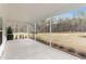 Expansive screened porch overlooking manicured lawn, mature trees, and tranquil pond at 105 Barker Street, Summerville, SC 29486