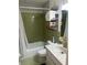 Tiled bathroom features a shower-tub combo, a sink with modern faucet, and ample storage space at 106 Labrador Ct, Summerville, SC 29485