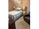 Cozy bedroom showcasing comfortable seating, a nightstand, and a plush bed with decorative pillows at 106 Labrador Ct, Summerville, SC 29485
