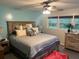 Bright bedroom featuring a large bed, ceiling fan, dresser, and natural light from the window at 106 Labrador Ct, Summerville, SC 29485