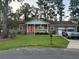Charming brick home with a well-manicured lawn and an inviting front porch at 106 Labrador Ct, Summerville, SC 29485