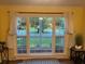Bright view through a large window showcasing a lush outdoor landscape, complete with stylish curtains at 106 Labrador Ct, Summerville, SC 29485