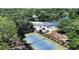Aerial view showcasing community tennis courts, pool, clubhouse, and picturesque water features at 1075 Wayfarer Ln, Charleston, SC 29412