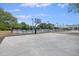Community basketball court next to the pool with lighting and a paved surface for recreational activities at 1075 Wayfarer Ln, Charleston, SC 29412