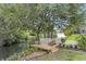 Waterfront property with a wooden dock perfect for relaxing and enjoying the tranquil view at 1075 Wayfarer Ln, Charleston, SC 29412