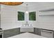 Bright kitchen with farmhouse sink, stainless dishwasher, and large window overlooking greenery at 1075 Wayfarer Ln, Charleston, SC 29412