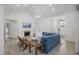 Bright living room featuring shiplap walls, fireplace, chandelier, and stylish furnishings at 1075 Wayfarer Ln, Charleston, SC 29412