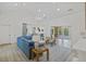 Open living room with shiplap, modern lighting, and seamless flow to kitchen at 1075 Wayfarer Ln, Charleston, SC 29412
