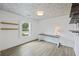 Bright office with a ceiling with floral wallpaper, a modern desk setup, and a window offering a view of the outdoors at 1075 Wayfarer Ln, Charleston, SC 29412