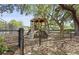 Community playground surrounded by mature trees, providing a shaded and fun play area at 1075 Wayfarer Ln, Charleston, SC 29412