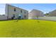 Spacious backyard featuring a lush lawn, privacy fence, and outdoor seating perfect for entertaining and relaxation at 108 Rusting Link Rd, Summerville, SC 29483