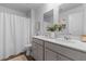 Bathroom with double sinks, a white shower curtain, and a neutral color scheme for a relaxing and functional design at 108 Rusting Link Rd, Summerville, SC 29483