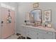 Warm foyer with a decorative dresser, gold mirror, and pink door, creating an inviting entrance at 108 Rusting Link Rd, Summerville, SC 29483