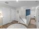 Upstairs hallway that features fresh paint, wood floors, and natural lighting at 108 Rusting Link Rd, Summerville, SC 29483