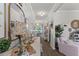 Bright hallway with hardwood floors, decorative furnishings, and views into adjoining rooms at 108 Rusting Link Rd, Summerville, SC 29483