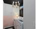 Efficient laundry room with modern washer and dryer, chandelier lighting, and a clean, organized layout at 108 Rusting Link Rd, Summerville, SC 29483