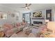 Comfortable living room with ceiling fan, fireplace, and neutral colors and natural lighting at 108 Rusting Link Rd, Summerville, SC 29483