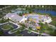 Stunning aerial view of the community featuring a pool, clubhouse, tennis courts, and pond at 109 Barker Street, Summerville, SC 29486