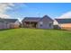 A backyard featuring a wood fence, green grass, a patio and the rear exterior of the house at 109 Dovetail Cir, Summerville, SC 29483