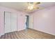 Bedroom featuring wood-look flooring, a ceiling fan, and a closet with sliding doors at 109 Dovetail Cir, Summerville, SC 29483