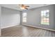 This bright bedroom features wood-look flooring, neutral colors, and ample natural light at 109 Dovetail Cir, Summerville, SC 29483