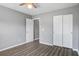 This bedroom offers ample closet space with double doors, and wood-look flooring at 109 Dovetail Cir, Summerville, SC 29483