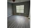 Modern bedroom featuring hard floors, neutral walls, ceiling fan, and ample natural light at 109 Dovetail Cir, Summerville, SC 29483