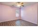 Bedroom featuring wood-look flooring, a ceiling fan, and natural light from a window at 109 Dovetail Cir, Summerville, SC 29483