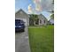 Charming single-story home with a well-manicured lawn, a driveway and a garage at 109 Dovetail Cir, Summerville, SC 29483