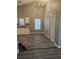 Bright kitchen space with white cabinets, granite countertops, and tile flooring at 109 Dovetail Cir, Summerville, SC 29483