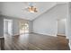 Spacious living room featuring wood flooring, a ceiling fan, and access to the outdoor patio at 109 Dovetail Cir, Summerville, SC 29483