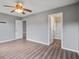 Spacious main bedroom with modern flooring, ceiling fan, and ensuite bathroom access at 109 Dovetail Cir, Summerville, SC 29483