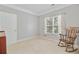 Bedroom with carpeted floor, rocking chair, and window with curtains at 1111 Basildon Rd, Mount Pleasant, SC 29466