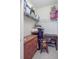 Walk-in closet with shelving filled with personal items and a small rocking chair at 1111 Basildon Rd, Mount Pleasant, SC 29466