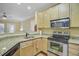 Bright kitchen boasts stainless steel appliances, granite countertops, and light wood cabinetry at 1111 Basildon Rd, Mount Pleasant, SC 29466