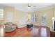Sunlit living room with hardwood floors, neutral tones, and a cozy atmosphere, perfect for relaxation at 1111 Basildon Rd, Mount Pleasant, SC 29466