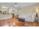 Spacious living room seamlessly flows into the kitchen, with hardwood floors and a comfortable seating area at 1111 Basildon Rd, Mount Pleasant, SC 29466