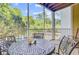 Screened porch with an outdoor seating area and natural views at 1111 Basildon Rd, Mount Pleasant, SC 29466