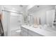 A bright bathroom featuring a vanity with counter space, a mirror, and a shower-tub combo at 113 Moscato Ln, Summerville, SC 29485