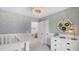 Adorable Bedroom features a crib, dresser, and playful decor creating a warm and inviting atmosphere at 113 Moscato Ln, Summerville, SC 29485