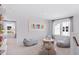 Cozy playroom boasts beanbag chairs, soft carpet, and bright natural light, making it the perfect space for children at 113 Moscato Ln, Summerville, SC 29485