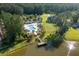 Aerial view of community amenities featuring a pool, cabanas, and lake access at 1130 Plantation Overlook Dr, Moncks Corner, SC 29461