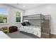 Bright bedroom with a bunk bed, and natural light streaming through the windows at 1130 Plantation Overlook Dr, Moncks Corner, SC 29461